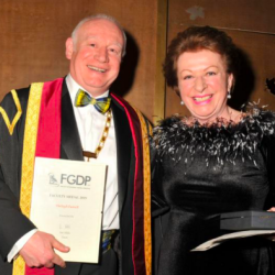 Shelagh Farrell receiving the Faculty Medal from FGDP(UK) Dean Ian Mills